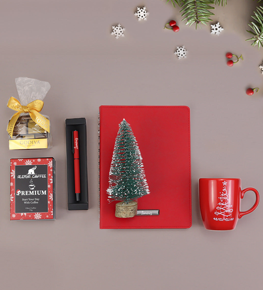 Kişiye Özel Kırmızı Spiralli Yeni Yıl Tarihli Ajanda & Kırmızı Mat Roller Kalem & Mutlu Yıllar Kupa & Ahşap Zeminli Mini Çam Ağacı & Godiva Napoliten Çikolata & Alerya Yılbaşı Premium Filtre Kahve Hediye Seti