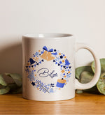 Kişiye Özel Mavi Yumuşak Kapaklı Not Defteri & Yılbaşı Baskılı Kupa & Yılbaşı Temalı Metal Kutulu Mum & Mavi Mat Roller Kalem Hediye Seti